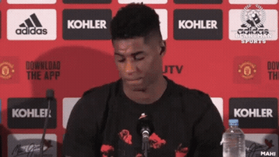 Man In Front Of Microphone With Kohler Logo GIF