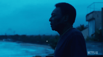 Man In Front Of Netflix Sign GIF