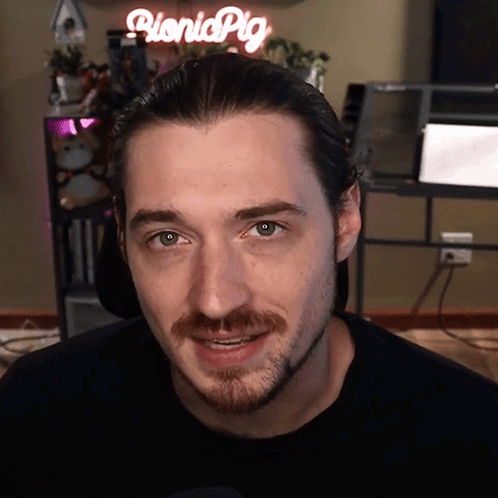 Man In Front Of Picnicpig Sign GIF