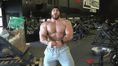 Man in Front of Pure Muscle Fitness Gym