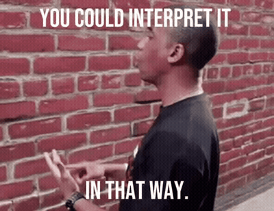 Man In Front Of Red Brick Wall Saying You Could Interpret It In That Way GIF