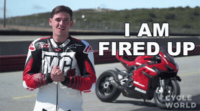 Man In Front Of Red Ducati Saying I Am Fired Up GIF