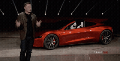 Man In Front Of Red Tesla Model S GIF