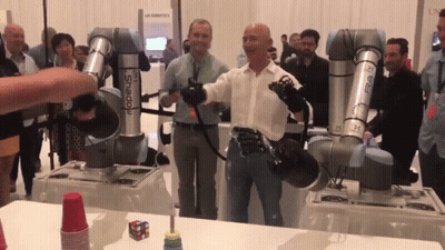 Man in Front of Robot Arm Saying Shadow