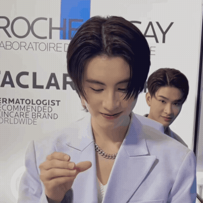 Man In Front Of Rochesay Sign GIF