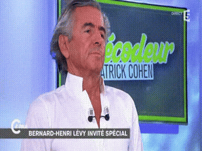 Man In Front Of Screen Saying Patrick Cohen GIF