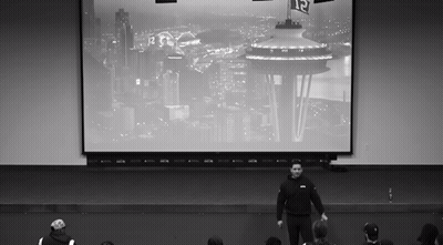 Man In Front Of Seattle Screen With Number 12 GIF