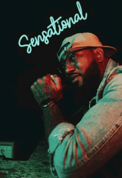 Man In Front Of Sensational Neon Sign GIF