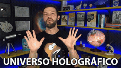 Man In Front Of Shelf Saying Universo Holographico GIF