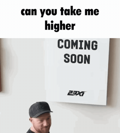 Man in Front of Sign Saying Can You Take Me Higher Coming Soon
