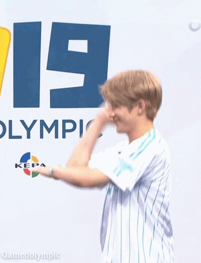 Man In Front Of Sign Saying Olympic GIF