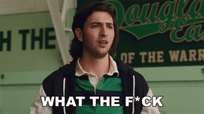 Man In Front Of Sign Saying What The F*ck GIF