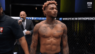 Man In Front Of Sign Saying World's Number 1 In Orthopedics GIF