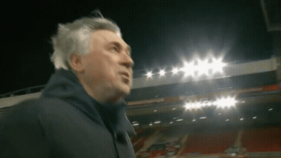 Man In Front Of Stadium With Lights On GIF