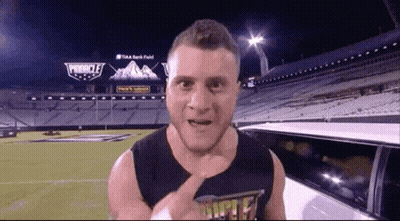 Man In Front Of Stadium With Providence Sign GIF