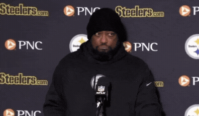 Man In Front Of Steelers.com Wall GIF