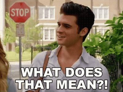Man In Front Of Stop Sign Saying What Does That Mean GIF