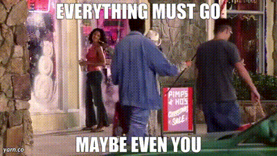 Man In Front Of Store With Pimps & Hots Christmas Sale Sign GIF