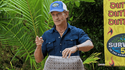 Man In Front Of Survivor 5 Banner GIF
