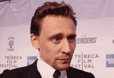 Man In Front Of Tribeca Film Festival Sign GIF