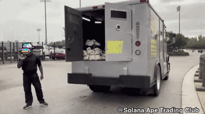 Man In Front Of Truck Saying Solana Ape Trading Club GIF
