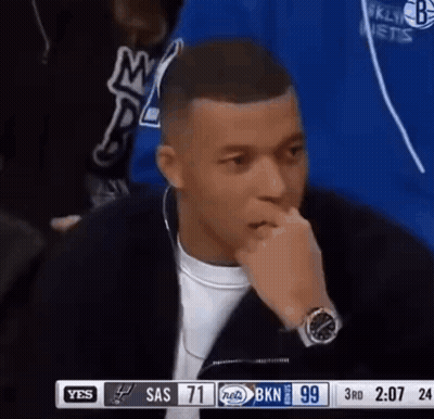 Man In Front Of TV Hand On Mouth GIF