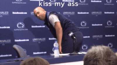 Man In Front Of Wall Saying Rivaled GIF