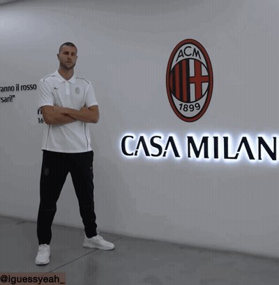 Man In Front Of Wall With ACM Logo GIF
