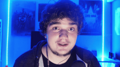 Man In Front Of Wall With Live Wild Poster GIF