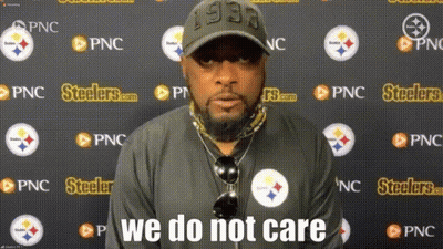 Man In Front Of Wall With Steelers Logos GIF