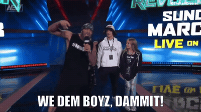 Man In Front Of We Dem Boyz Sign GIF