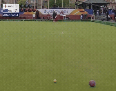 Man In Front Of Wealth Games Sign GIF