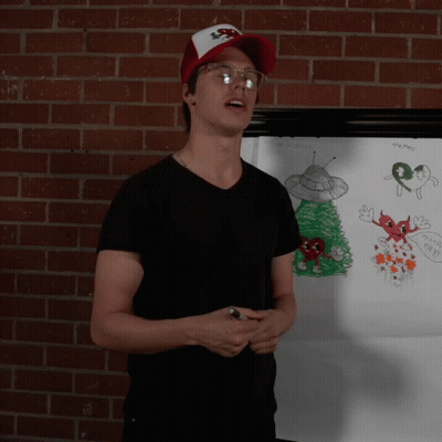 Man In Front Of White Board With X-Files Drawing GIF