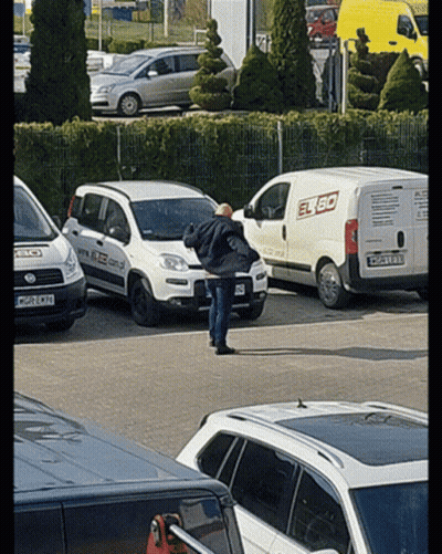 Man In Front Of White Van Saying Elbo GIF