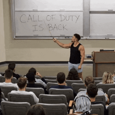 Man In Front Of Whiteboard Saying Call Of Duty Is Back GIF