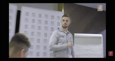 Man In Front Of Whiteboard With Liverpool Logo GIF