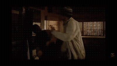 Man In Front Of Window With Blinds GIF