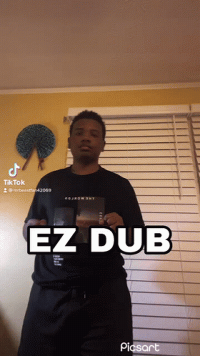 Man In Front Of Window With EZ Dub On Shirt GIF