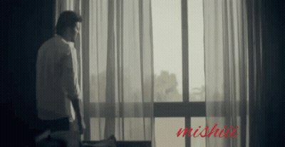 Man In Front Of Window With Word Mishai GIF