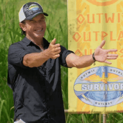 Man In Front Of Yellow Sign Saying Outwit Outplay Survivor GIF