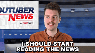 Man In Front Of YouTuber News Sign GIF