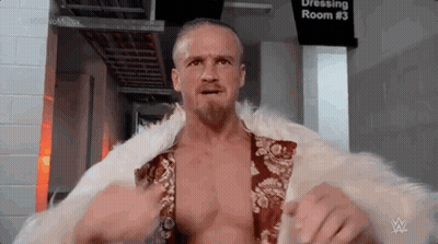 Man In Fur Coat And Beard In Dressing Room GIF