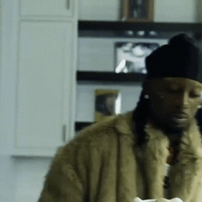 Man In Fur Coat And Black Hat GIF