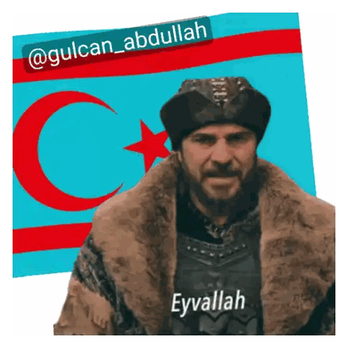 Man In Fur Coat And Hat With Eyvallah Sticker