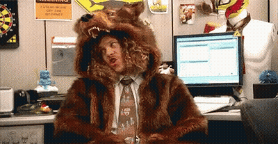 Man In Fur Coat And Tie At Computer GIF