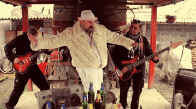 Man In Fur Coat At Danger Sign GIF