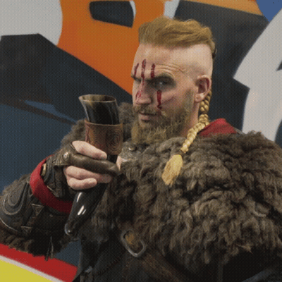 Man In Fur Coat Holding Horn GIF