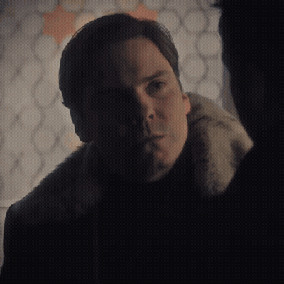 Man In Fur Coat Looking At Another Man GIF