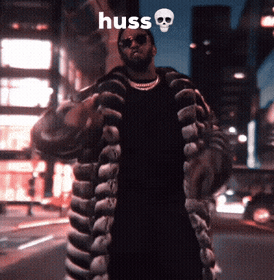 Man In Fur Coat Saying Huss GIF