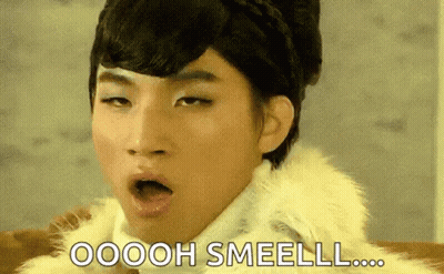Man In Fur Coat Says Oooh Smeell GIF